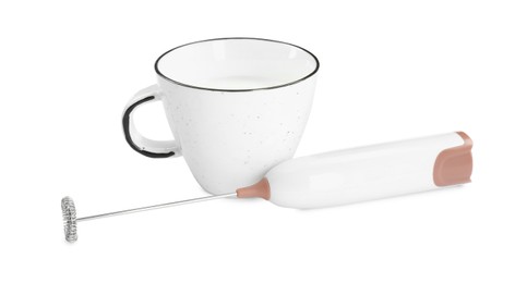 Photo of Milk frother wand and cup isolated on white