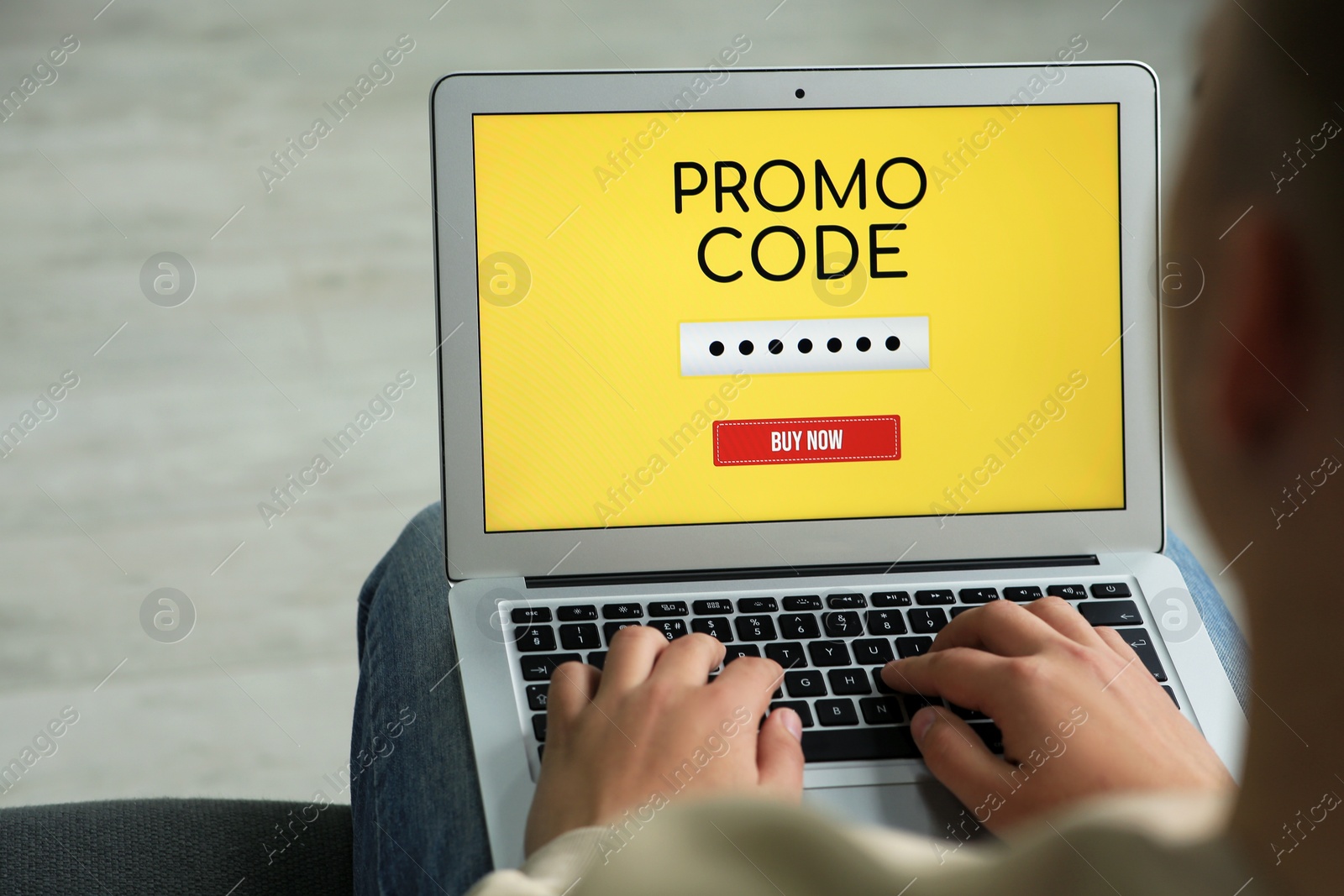 Photo of Woman with laptop activating promo code while doing online shopping, closeup