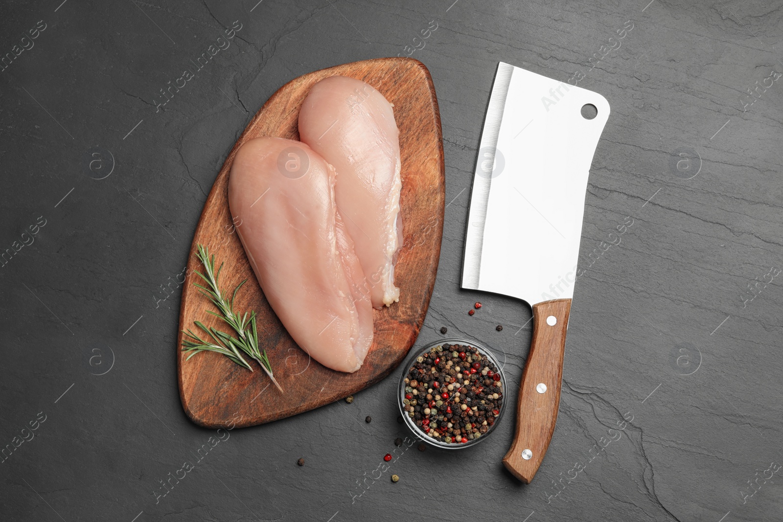 Photo of Flat lay composition with fresh chicken meat on black table