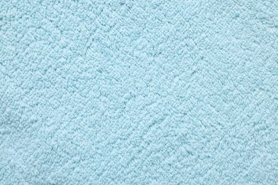 Photo of Texture of soft light blue fabric as background, top view