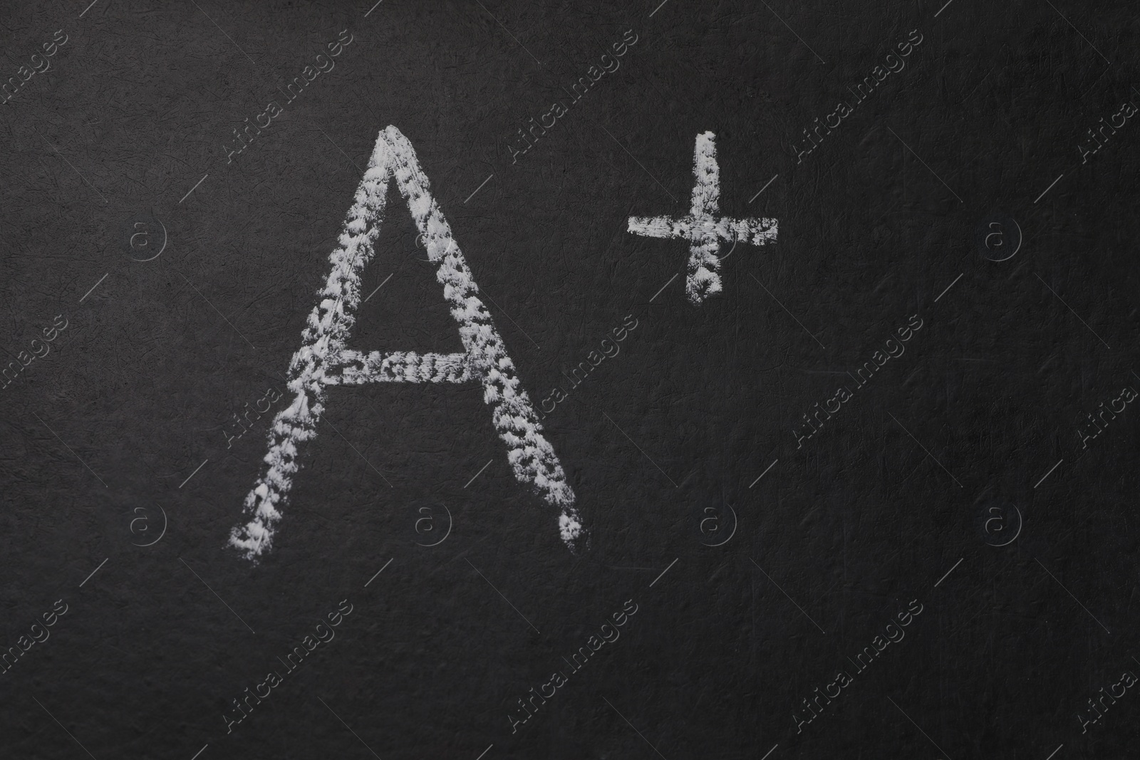 Photo of School grade. Letter A with plus symbol on blackboard, top view. Space for text