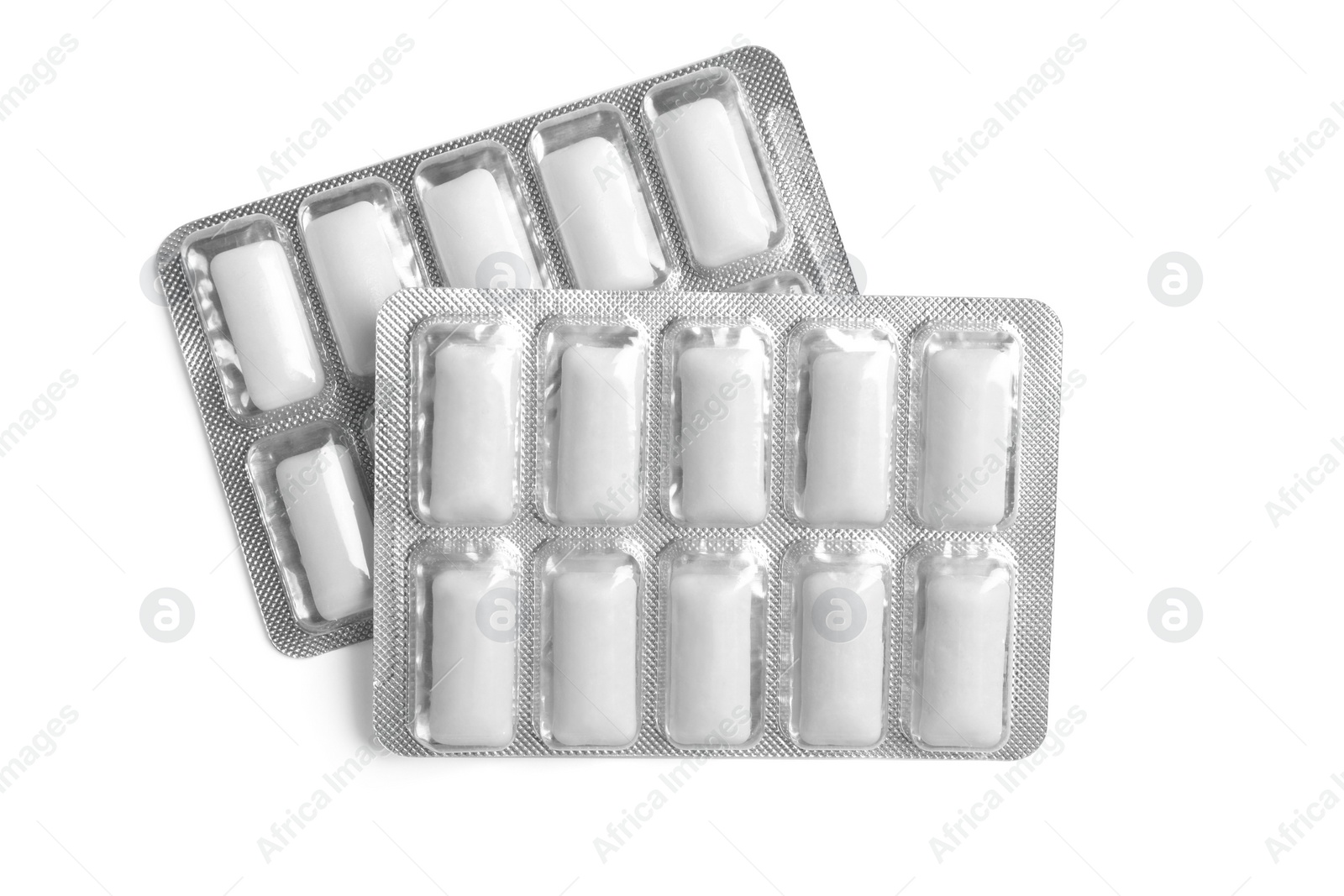 Photo of Blisters of chewing gums isolated on white, top view