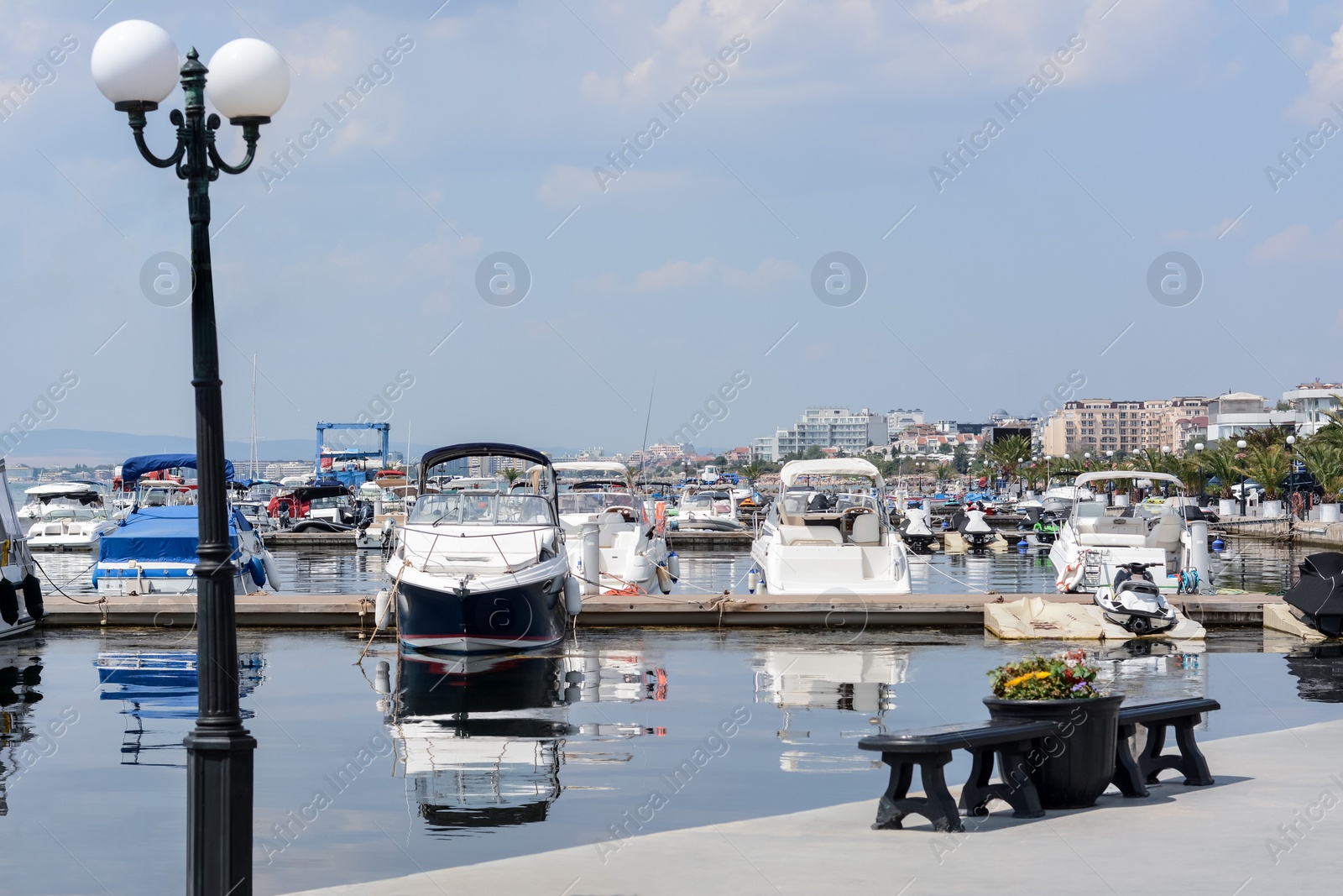 Photo of Beautiful view of city pier with moored boats on sunny day