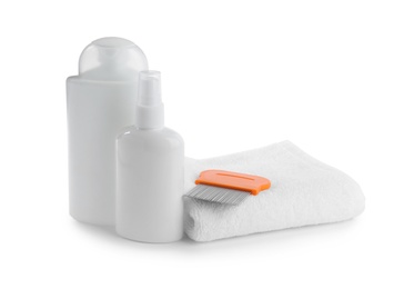 Products for anti lice treatment, metal comb and towel on white background