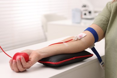 Photo of Patient undergoing blood transfusion in hospital, closeup