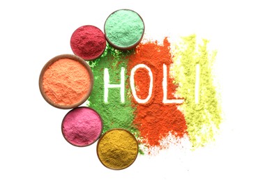 Colorful powders with word Holi on white background, top view