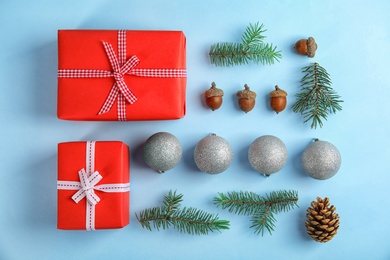 Flat lay composition with branches of Christmas tree on color background