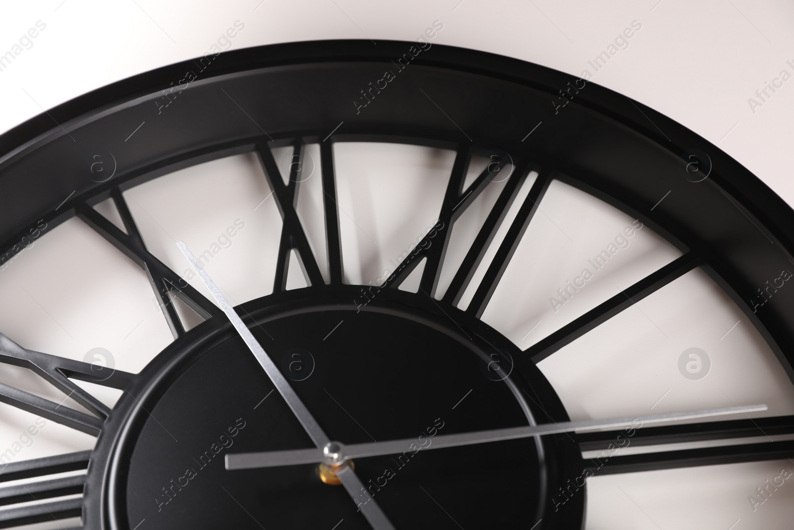 Photo of Stylish analog clock on white background, closeup