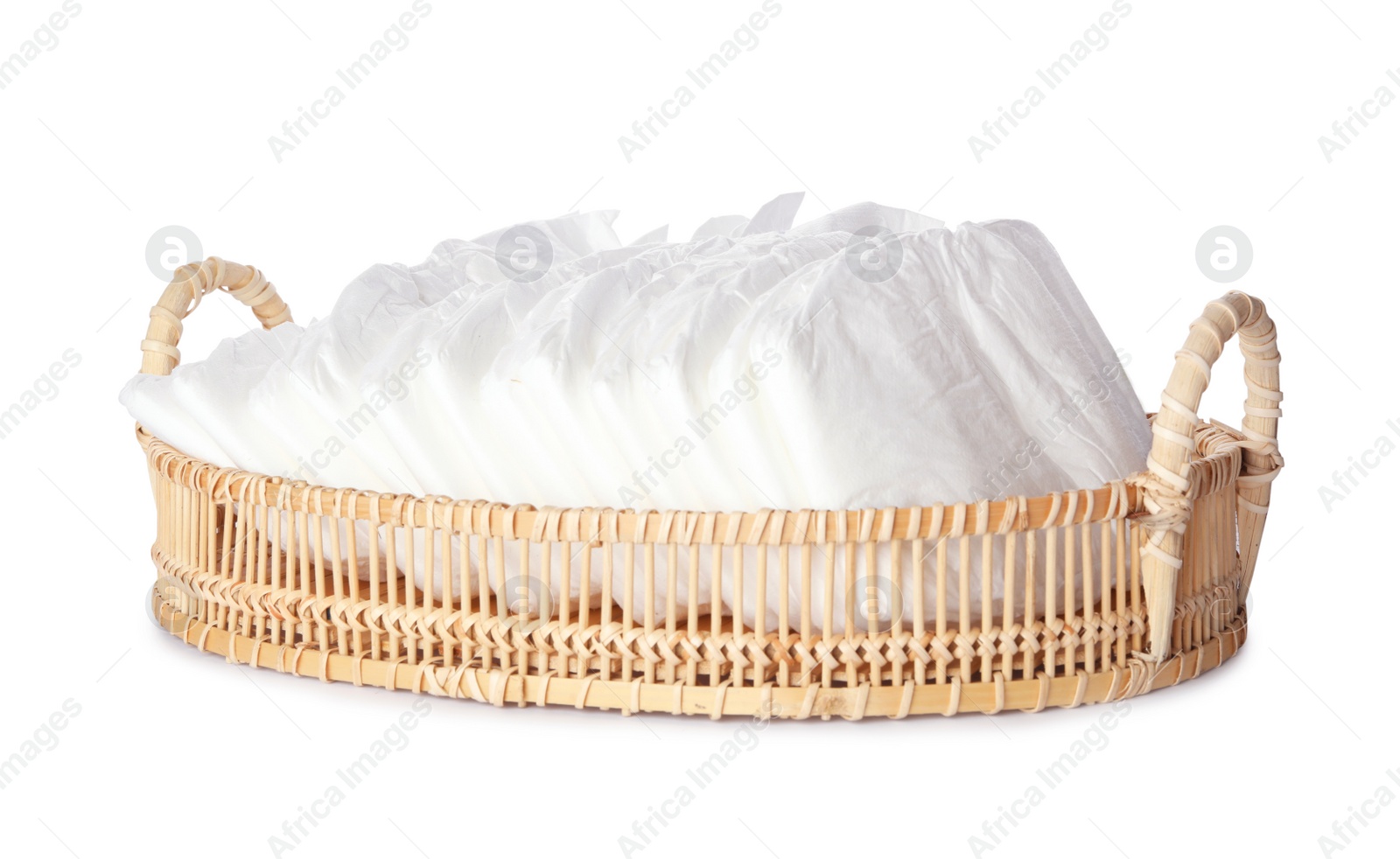 Photo of Wicker tray with disposable diapers isolated on white