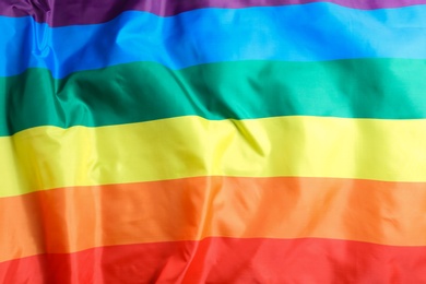 Photo of Bright rainbow gay flag as background. LGBT community