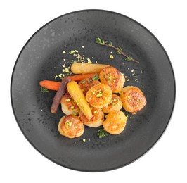 Delicious fried scallops with carrot and spices isolated on white, top view