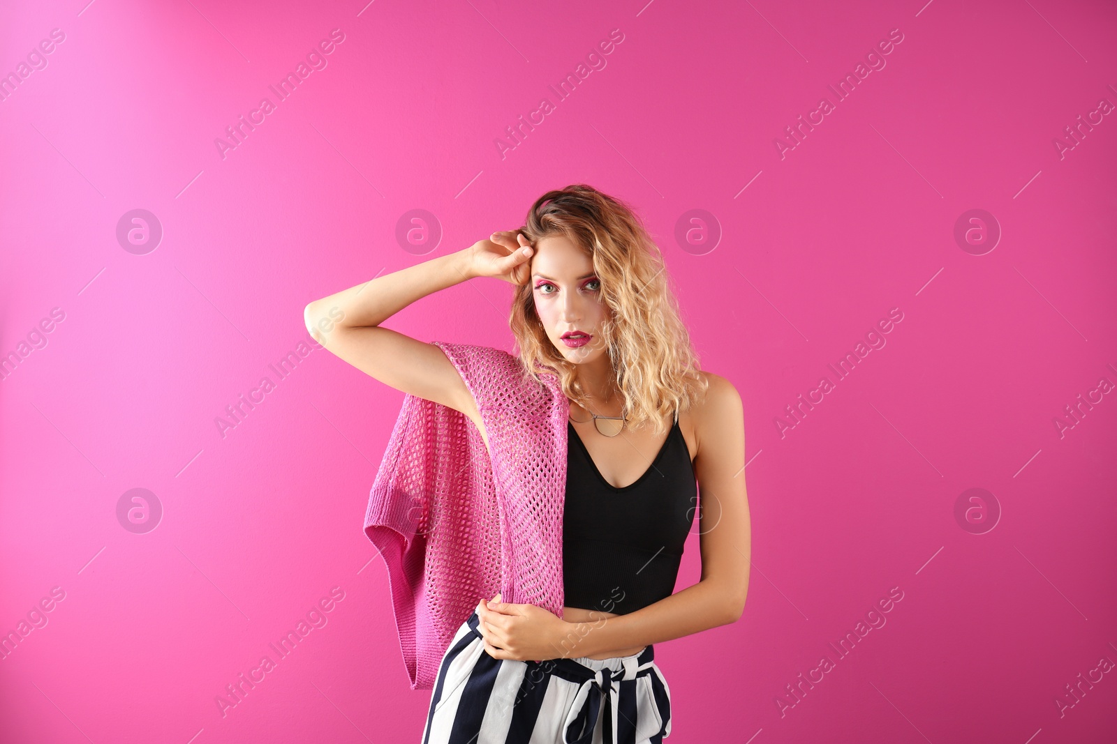 Photo of Beautiful young woman posing on color background. Summer fashion