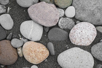 Photo of Many different pebbles as background, top view