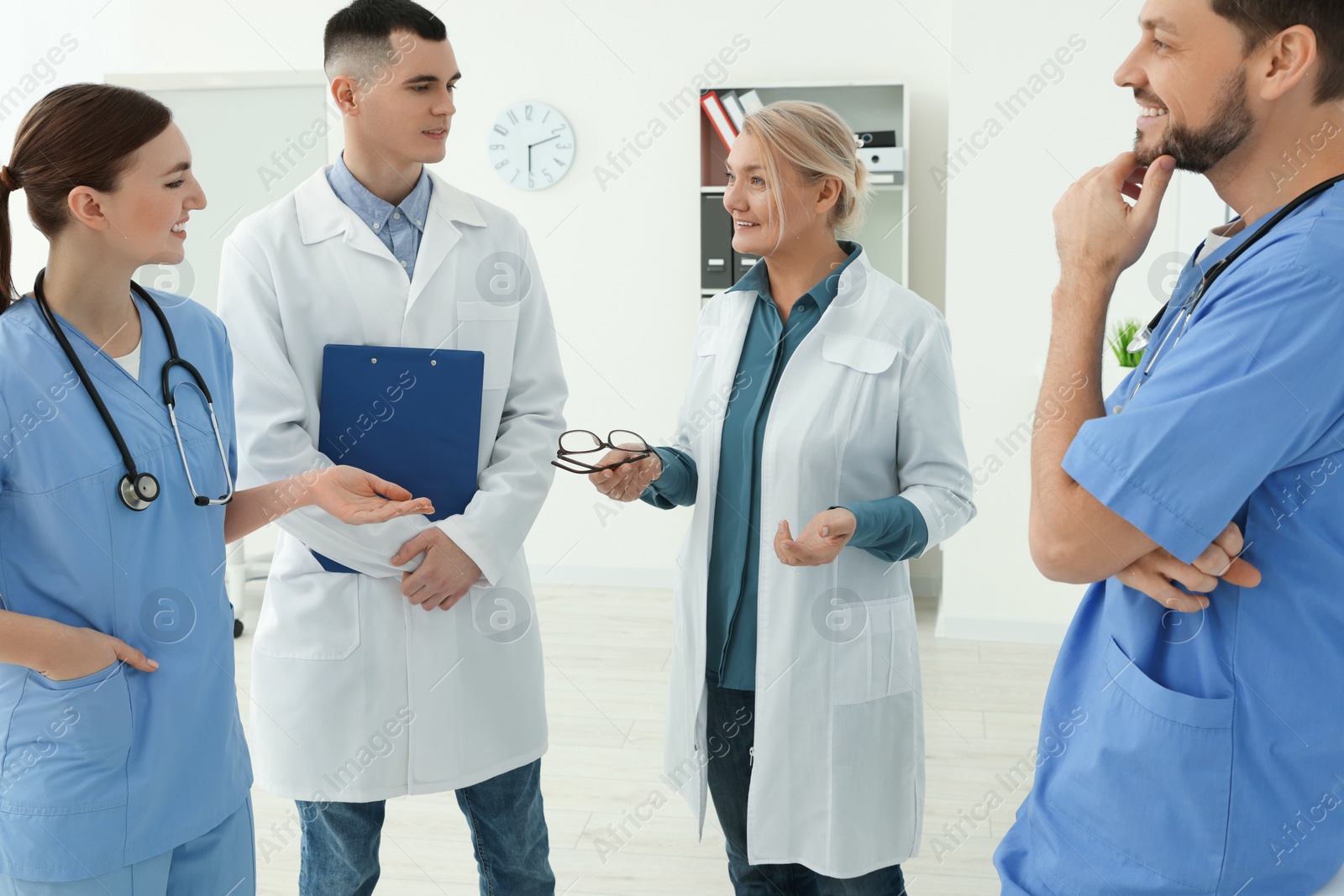 Photo of Team of doctors having discussion in clinic