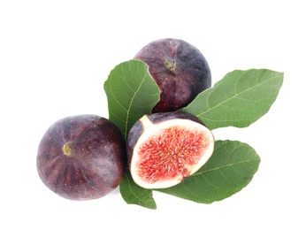 Photo of Fresh juicy purple figs and green leaves on white background, top view