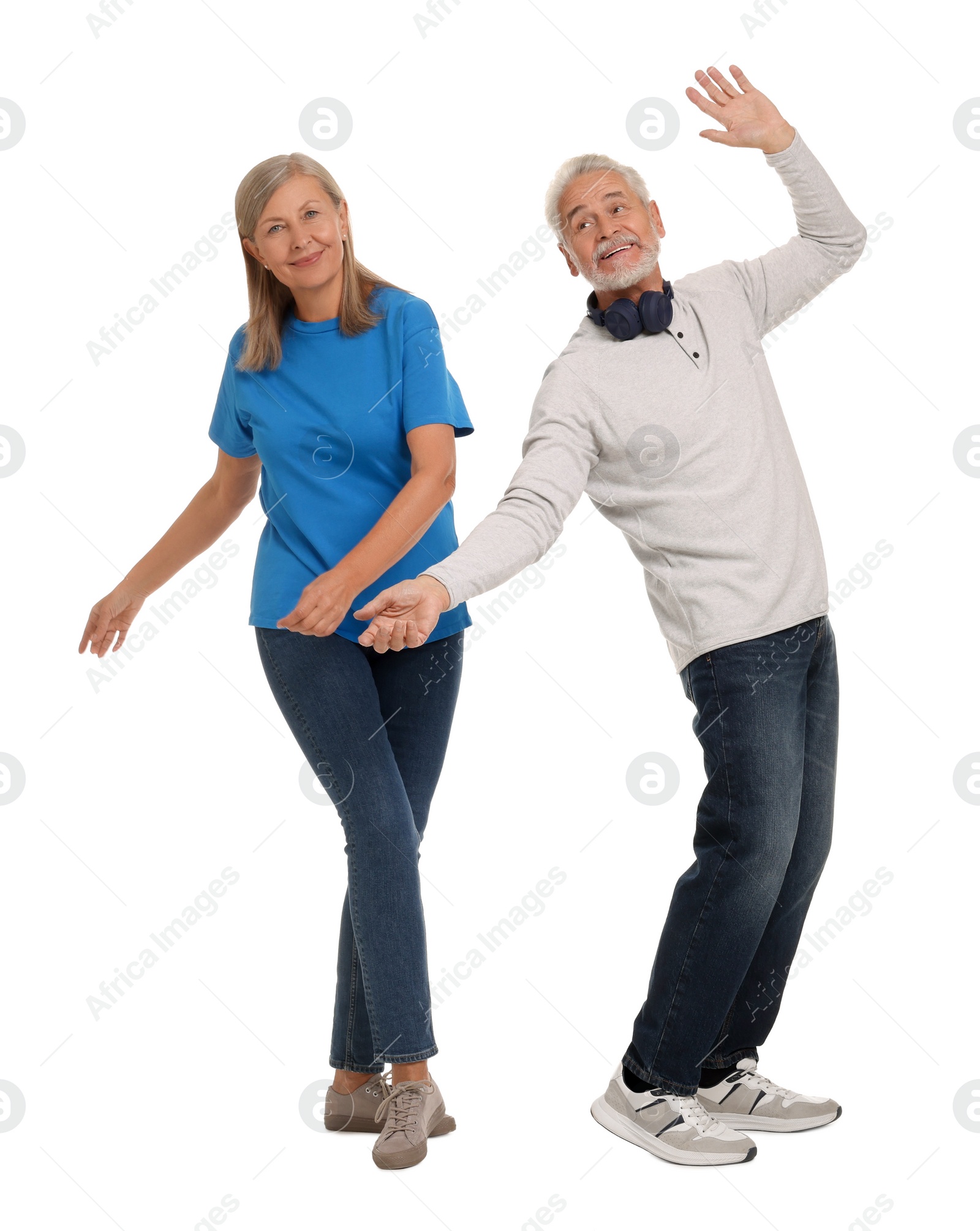 Photo of Senior couple dancing together on white background