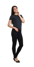 Photo of Woman wearing stylish black jeans and high heels shoes on white background