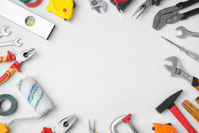 Photo of Flat lay composition with construction tools on white background. Space for text