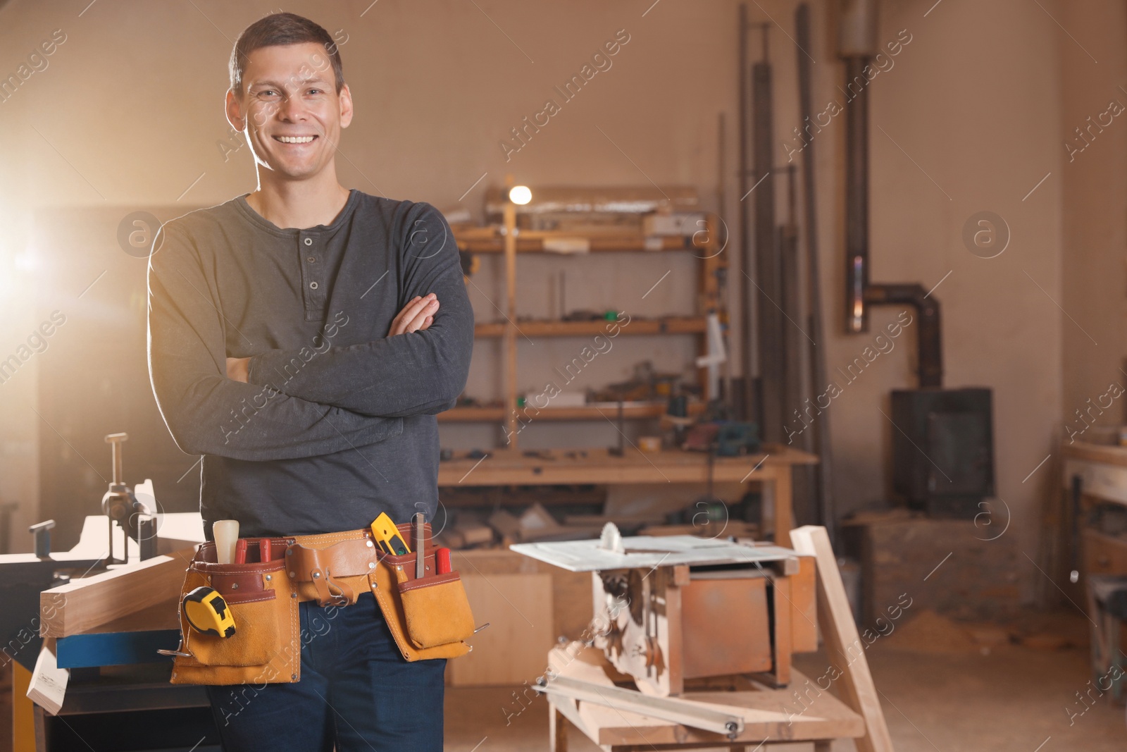 Photo of Professional carpenter with set of tools in workshop