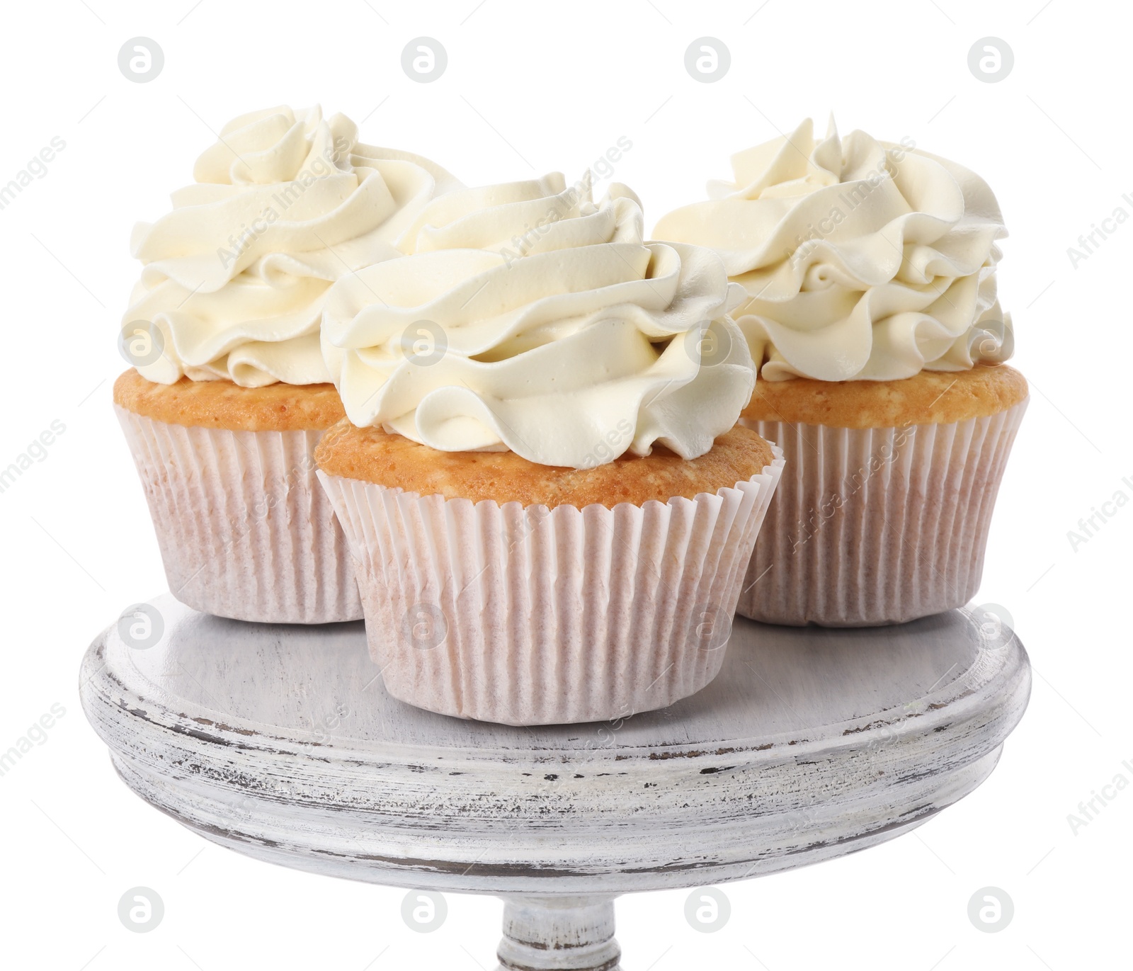 Photo of Tasty vanilla cupcakes with cream isolated on white