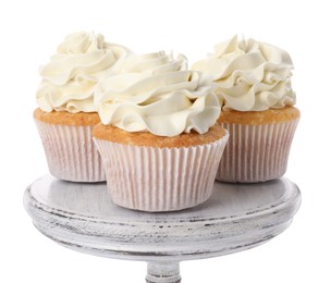 Tasty vanilla cupcakes with cream isolated on white