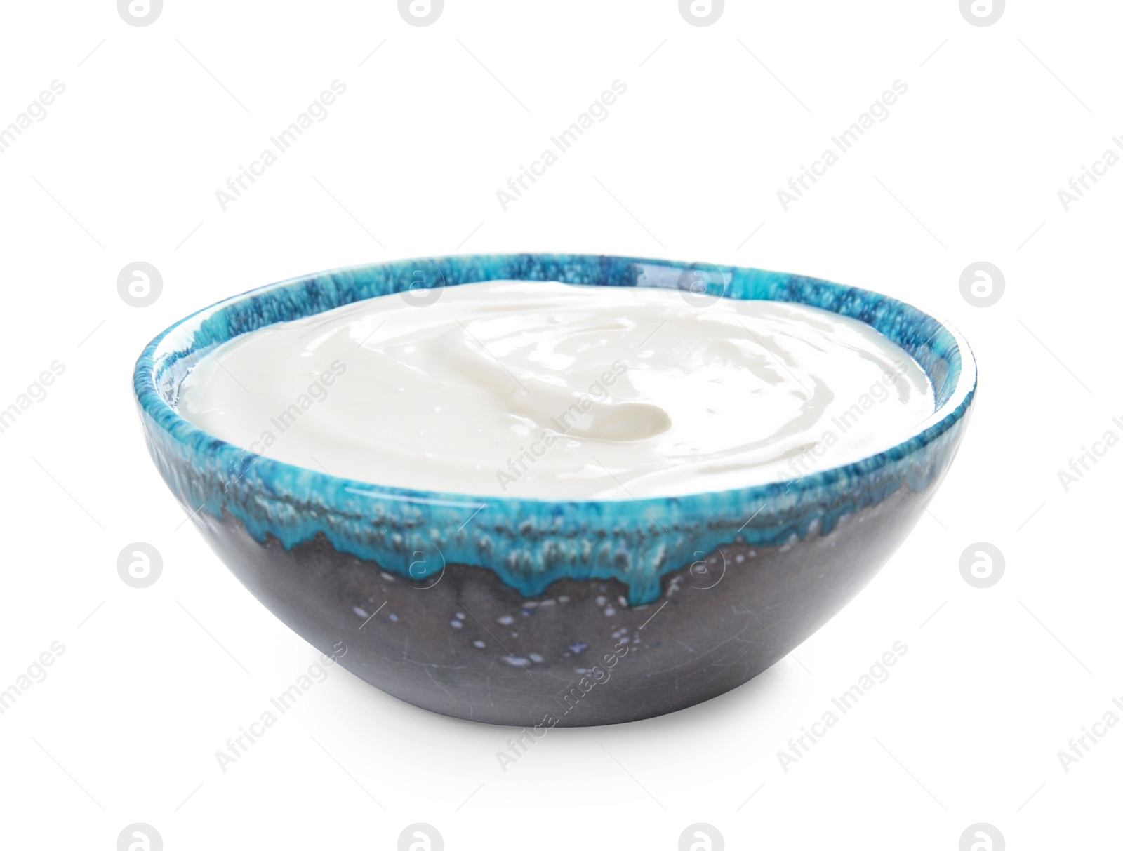 Photo of Bowl with creamy yogurt on white background