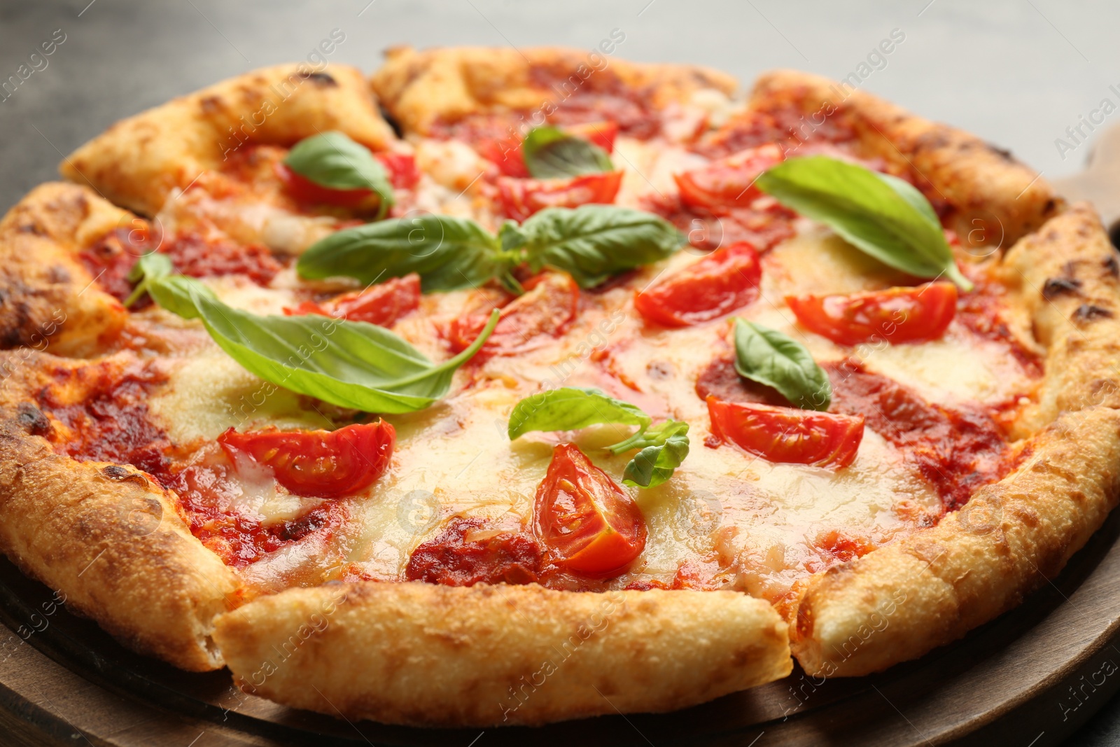 Photo of Delicious Margherita pizza on table, closeup view
