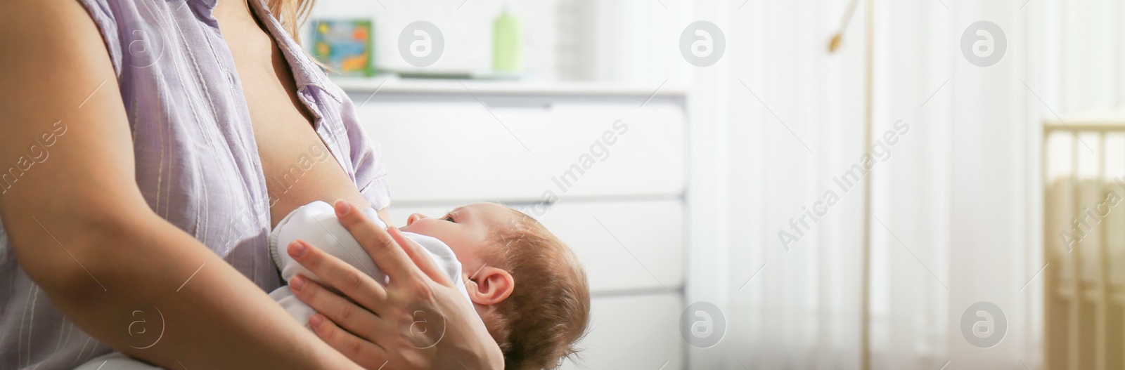 Image of Young woman breast feeding her little baby at home, space for text. Banner design