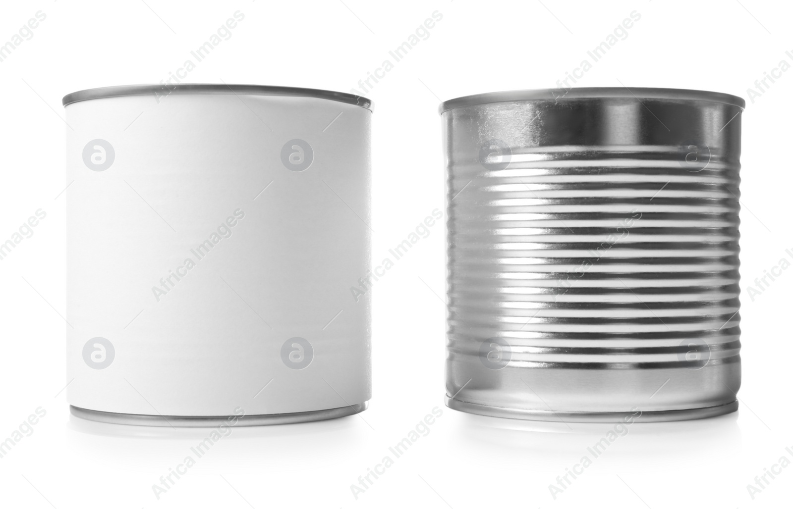 Photo of Closed tin cans isolated on white, mockup for design