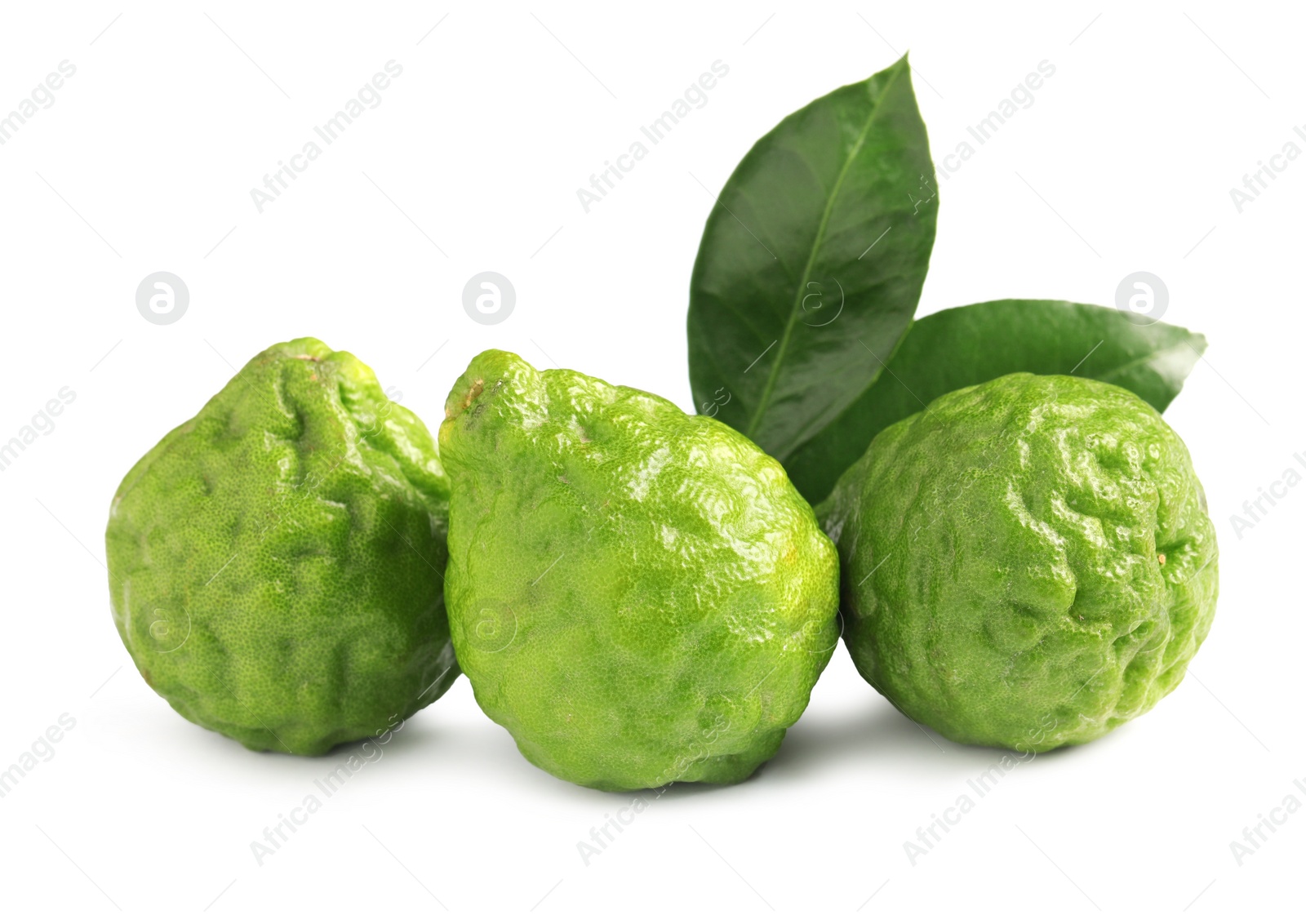 Photo of Fresh ripe bergamot fruits and leaves on white background