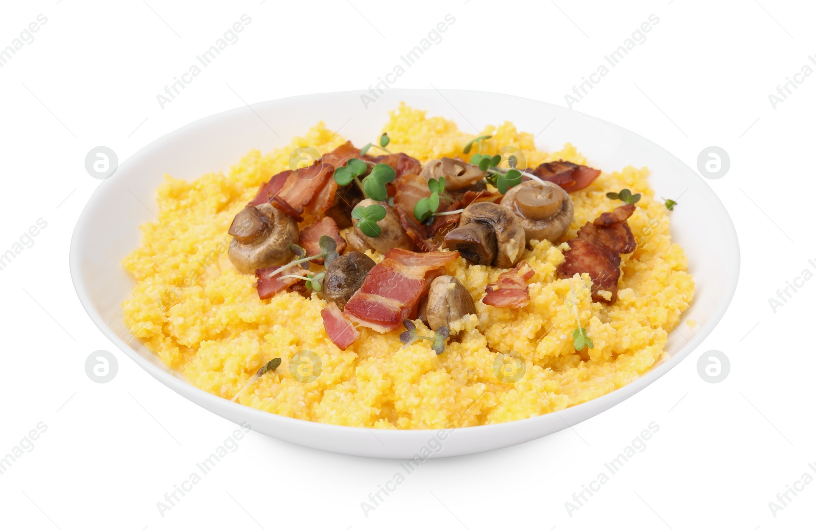 Photo of Tasty cornmeal with bacon and mushrooms in bowl isolated on white