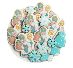 Tasty gingerbread cookies on white background, top view. St. Nicholas Day celebration