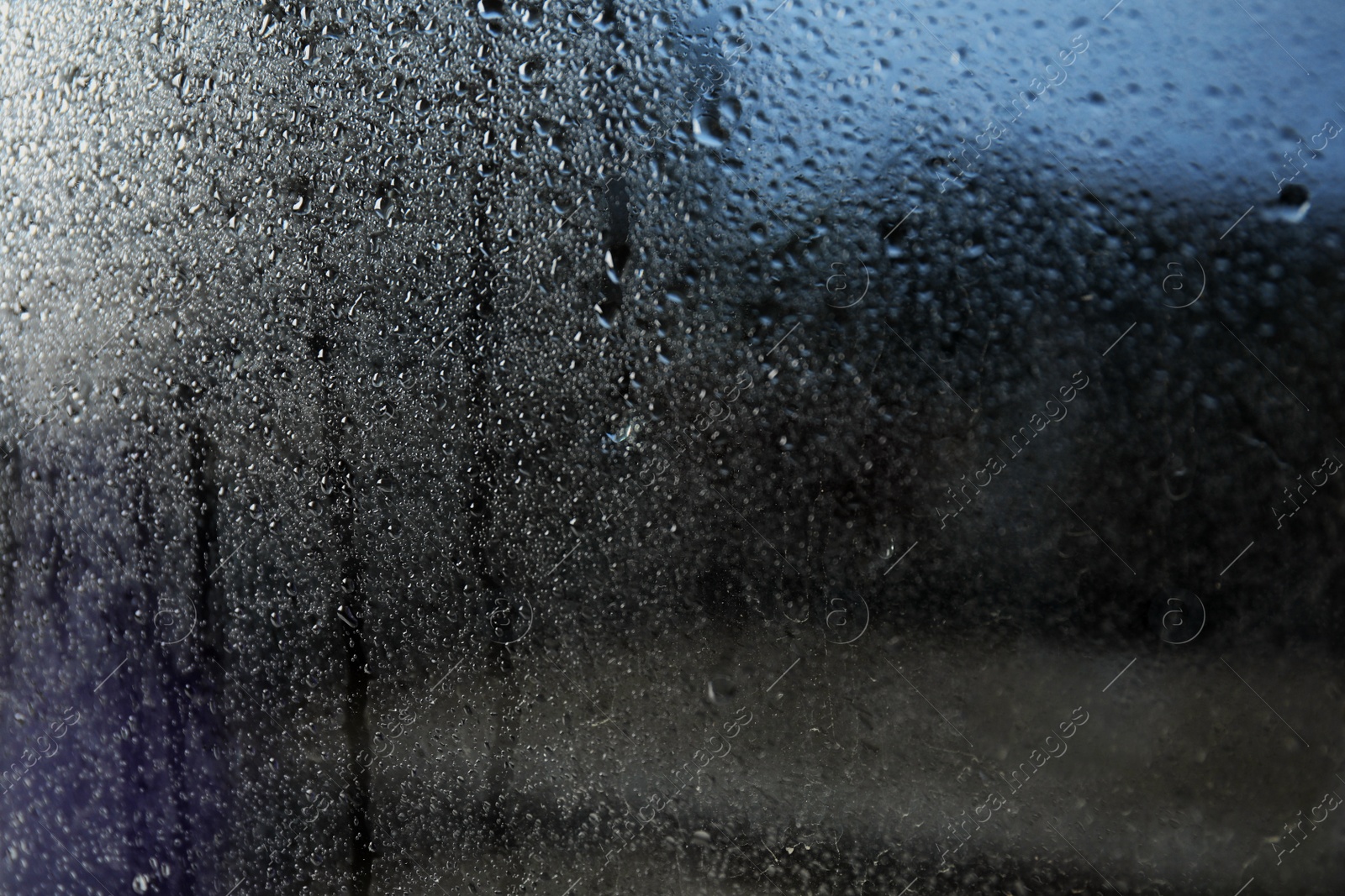 Photo of Rain drops on window glass as background