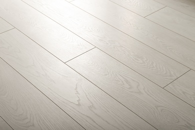 Light wooden laminate as background. Floor covering