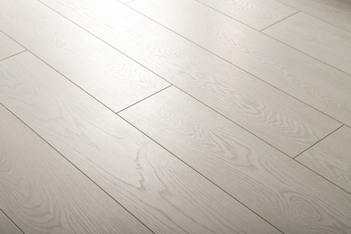 Photo of Light wooden laminate as background. Floor covering