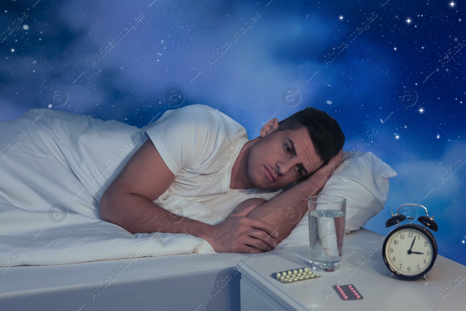 Image of Man suffering from insomnia in bed and beautiful starry sky on background