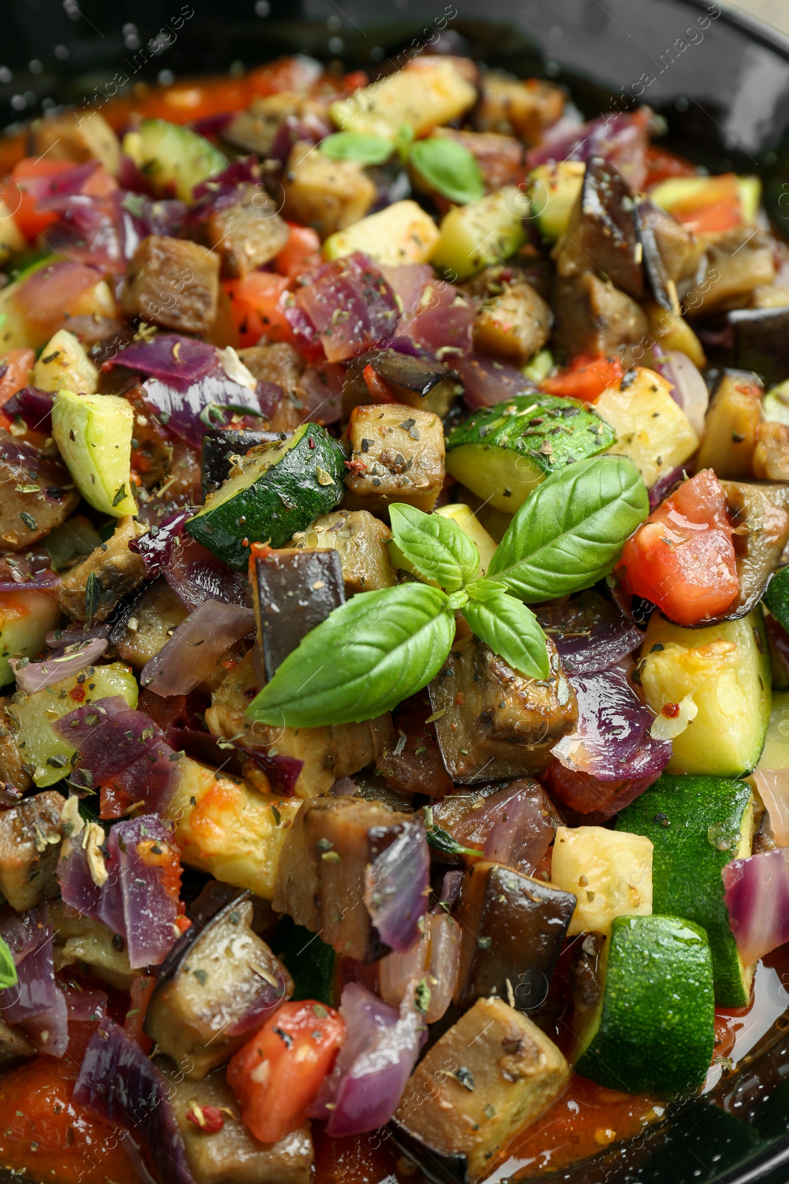 Photo of Delicious ratatouille in baking dish, closeup view