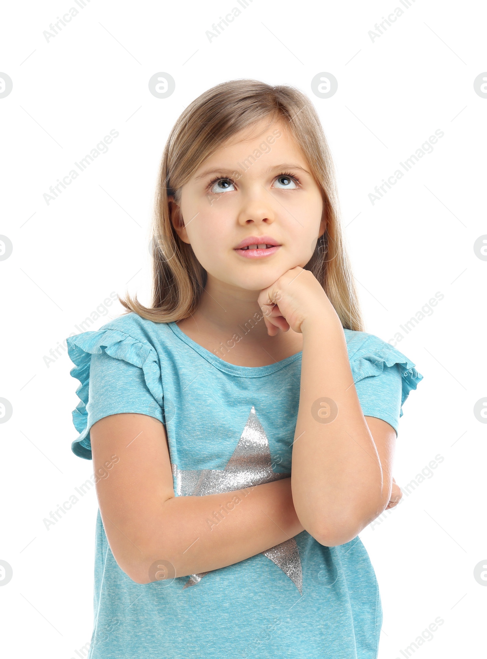 Photo of Thoughtful little girl wearing casual outfit on white background