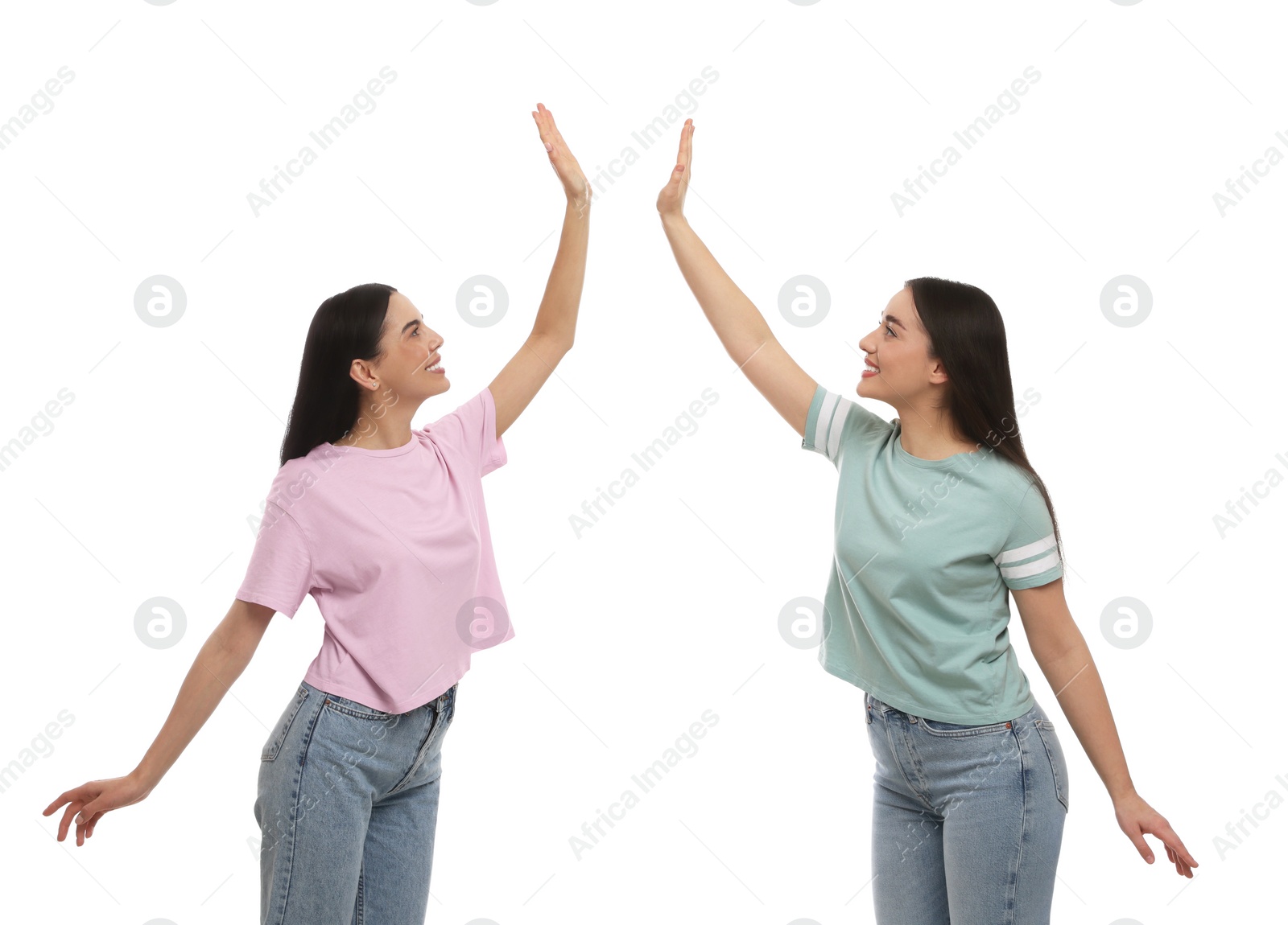 Photo of Women giving high five on white background