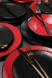 Elegant table setting. Many plates and cutlery, closeup