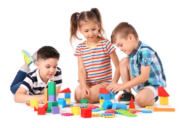 Photo of Little children playing together on white background. Indoor entertainment