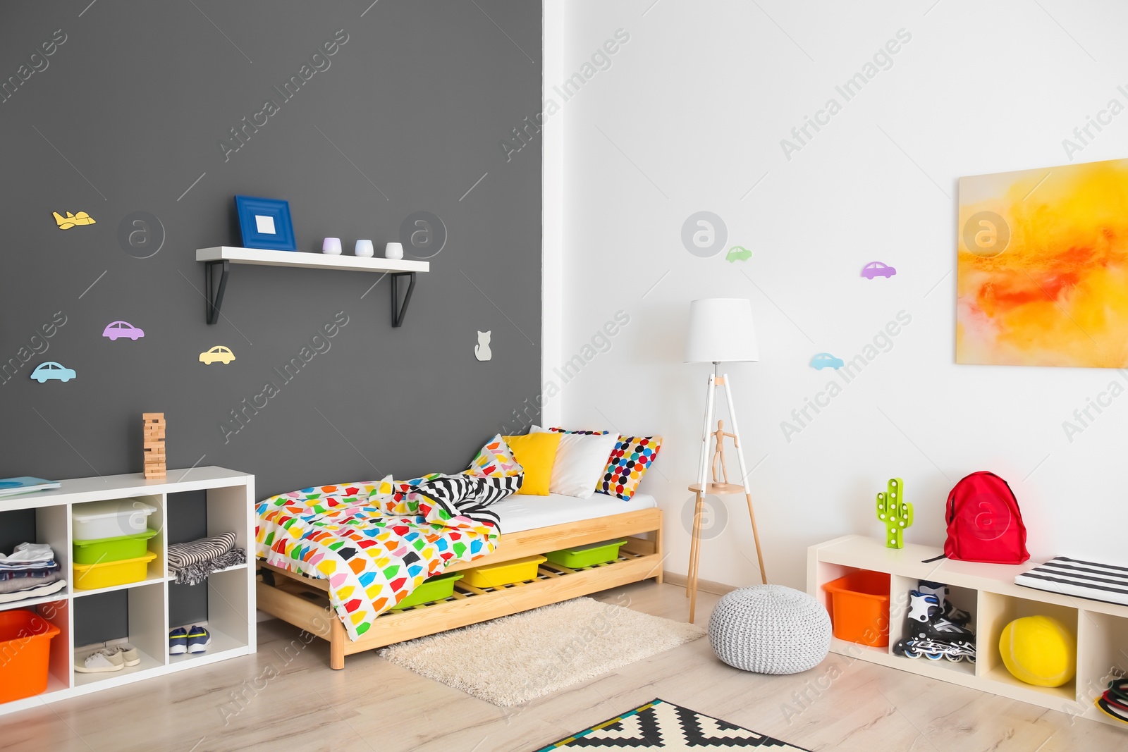 Photo of Modern room interior with comfortable bed for child