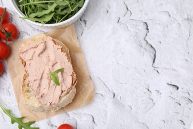 Delicious liverwurst sandwich with basil and ingredients on white textured table, flat lay. Space for text