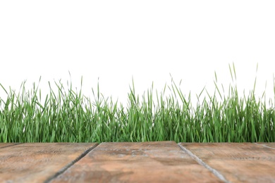 Photo of Wooden deck and green grass isolated on white