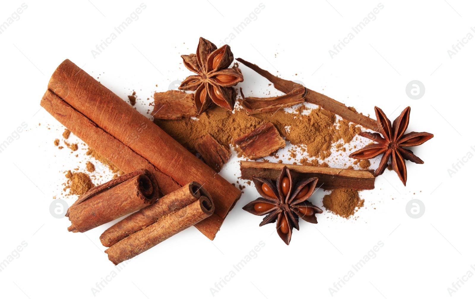 Photo of Dry aromatic cinnamon sticks, powder and anise stars isolated on white, top view