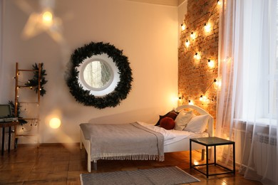 Cozy bedroom with stylish Christmas decor. Interior design