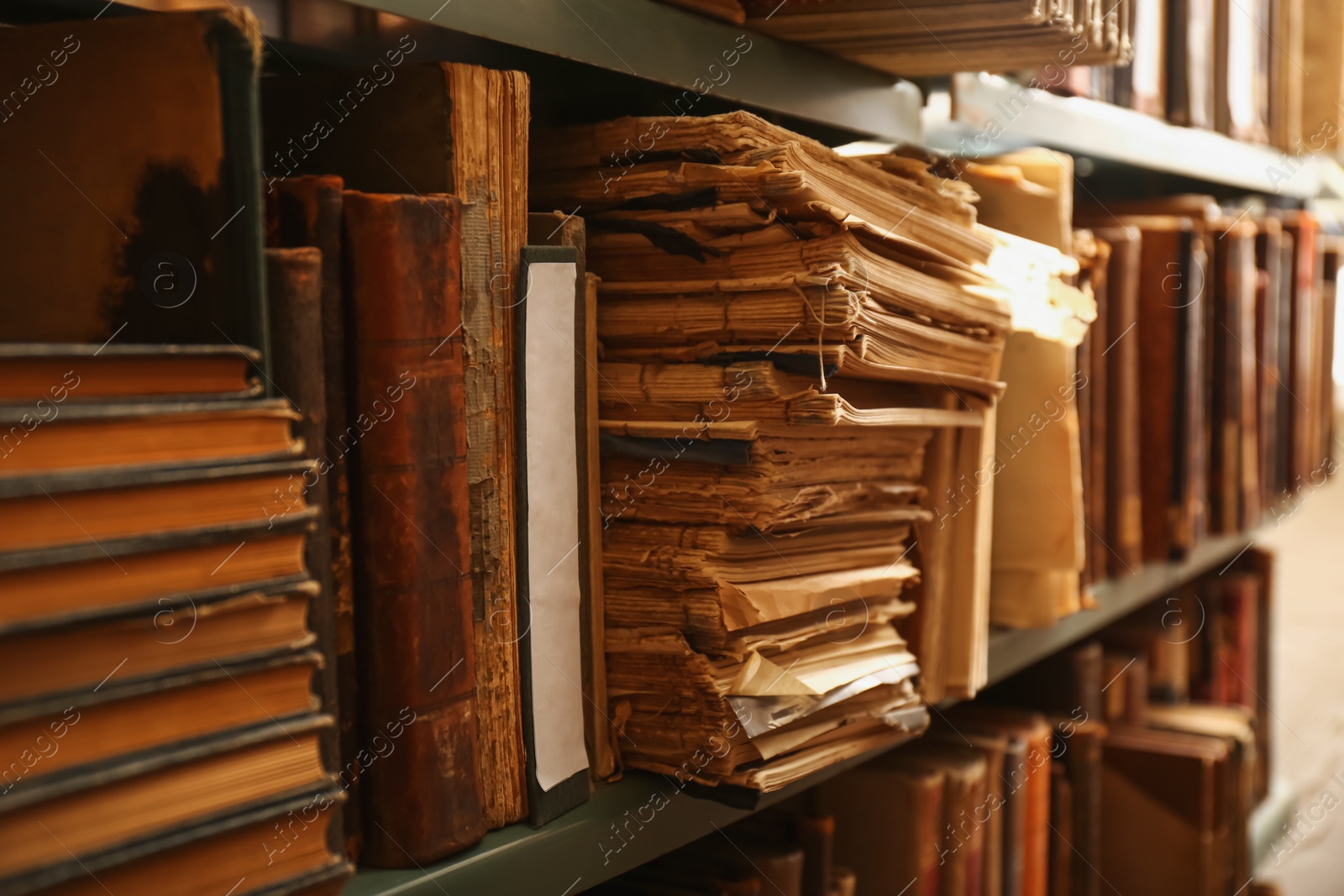 Photo of Collection of old books on shelves in library