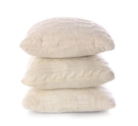 Stack of soft pillows on white background