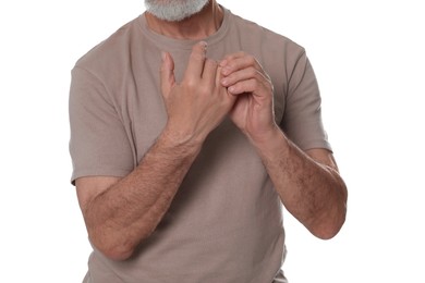 Photo of Senior man suffering from pain in hands on white background, closeup. Arthritis symptoms