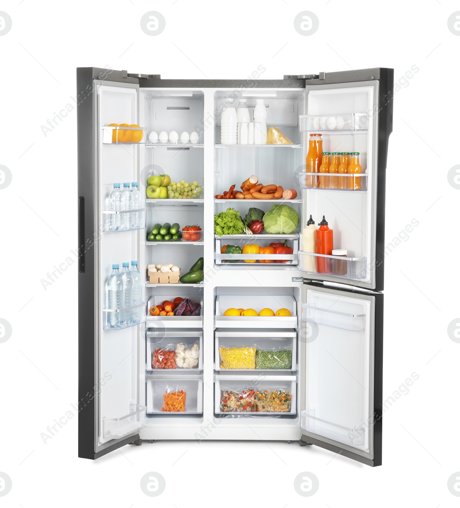 Photo of Open refrigerator full of products isolated on white